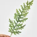 Macro detail of vibrant green artificial PE pine needle branch for Christmas wreath decoration - Large Leaf Pine Branch (SZ08)