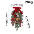 Christmas teardrop swag with pinecones, cinnamon, red bows and reindeer decoration - Cinnamon Pine Cone Teardrop Swag (L3-45) / 44x25cm