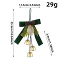 Pendentif nœud de Noël en velours vert avec cloches dorées et pommes de pin, long de 25,5 cm - Style Vert Trois Cloches