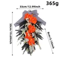 Halloween skeleton wreath with vibrant orange flowers and black foliage decoration - Halloween Skeleton Orange Flower Hanging Wreath / 33x8x50cm