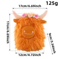 Variante peluche mucca Highland arancione da 17cm con corona di fiori decorativa - Stile Mucca delle Highland con Fiori Arancioni