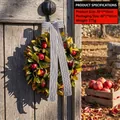 Rustic Christmas wreath with green leaves, red pomegranates, and a striped ribbon - U3-11 Large Pomegranate Wreath