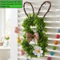 Artificial green bunny wreath with brown bow and white flower for Easter decor - Rabbit Wreath