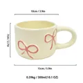 Cream ceramic bowknot mug 300ml capacity featuring detailed dimension and weight specifications - 300ml / Pink