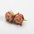 Close-up of two vintage-style silk rose buds with realistic burnt-edge details in dusty pink. - Dusty Pink