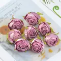 High-detail close-up of vintage burnt-edge silk rose buds in dusty pink for DIY decor - Purple