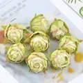 Detailed macro view of vintage burnt-edge silk rose buds for DIY flower arrangement - Light Green