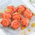 Detail view of vintage burnt edge rose buds for DIY wedding flower arrangement - Orange