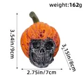 Decorative Halloween resin skull ornament wearing a pumpkin hat for holiday display - Closed Mouth Long Stem Pumpkin Style (AA2-31) / Orange with Silver-Black