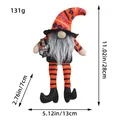 Halloween gnome doll with orange striped hat and long legs dimensions shown - Witch Gnome with Lantern (Z1-30)