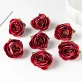 Detailed close-up view of seven vintage burgundy silk rose heads for DIY crafts and decor. - Red