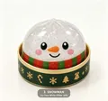 Close-up of icy clear-white glitter snowman jelly squishy toy in a green gift box - White Glitter Jelly Style / Snowman