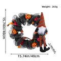 Διακοσμητικό στεφάνι πόρτας Halloween με νάνο με μακριά πόδια, μέγεθος 40cm - Μαύρο