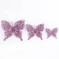 Set aus drei lila glitzernden hohlen Schmetterlingsdekorationen - Lila