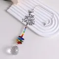 Detailed macro view of rainbow crystal suncatcher hanging ornament with life tree design - Bird on Branch