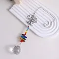 Macro view of rainbow crystal suncatcher with Tree of Life and faceted clear ball - Tree of Life