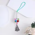 Close-up of Christmas bell charm featuring colorful bells and a silver metal tree pendant - Christmas Tree