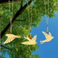 Detail showing golden bird suncatchers with rainbow crystal beads against nature background - Flying Bird / Three-Piece Set / Gold
