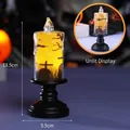 Black tall Halloween LED candle featuring bat and graveyard scene with warm orange glow - Bat Pattern / High-foot Style