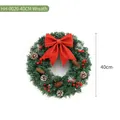 Couronne de Noël verte traditionnelle de 40 cm avec grand nœud pailleté rouge et pommes pin - Couronne de Noël / 40CM
