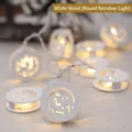 Decorative white wooden Christmas string lights featuring round reindeer cutout charms with warm LEDs - Round Elk Style