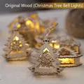 Wooden Christmas tree string lights with bell cutout and warm LED glow - Natural Wood Xmas Tree Bell Style
