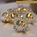Christmas wooden snowflake string lights with snowman pattern in warm white glow - Natural Wood Snowflake Snowman Style