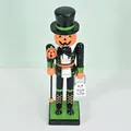 Decorative Halloween wooden nutcracker with pumpkin head holding Trick or Treat sign - Pumpkin Man / 25cm