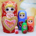 A collection of 5 traditional hand-painted wooden Russian nesting dolls in vibrant multi-colors - 5-Layer Red Heart Style / 11cm High / Red