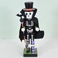 Handcrafted Halloween wooden skeleton nutcracker figurine in black cape with Ghost Town sign - Skull / 25cm