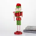 Detailed view of a 38cm tall red wooden nutcracker elf ornament for Christmas table decor. - Candy Style