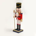 Detailed side view of a 25cm classic red and white wooden nutcracker soldier ornament. - 25*6.5*6.5CM / Light Gray