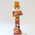 Close-up of 35cm wooden nutcracker soldier with gingerbread man theme and hand-painted details - Ginger Yellow Cookie House Style (58211-13) / 35cm