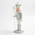 Side view of a 30cm silver and white decorative Christmas nutcracker soldier figurine. - 30cm / Silver Lotus Hat King (SB58510)