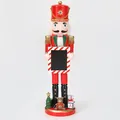 Close-up view of 38cm decorative wooden Nutcracker soldier holding a candy cane photo frame - Red