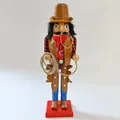 Detailed view of a wooden cowboy nutcracker figurine with lasso and red bandana. - Cowboy / 38cm
