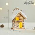 Miniature wooden Christmas cabin with warm glowing lights and snow decor on display. - Christmas Cabin Style (B8566) / 11.5x9x5.5cm