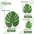 Set of 12 artificial monstera palm leaves in three assorted sizes for Hawaiian party decor - Artificial Monstera Leaves Set / 12-Piece Set