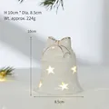 White ceramic bell-shaped Christmas ornament with glowing star cutouts, SKU variant - Wind Bell Style (YZ-23775)