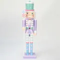 Detailed view of a 38cm candy-themed nutcracker soldier ornament in pastel colors - 38cm / Violet
