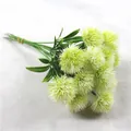 Close-up of green artificial dandelion bouquet for home wedding decoration - White