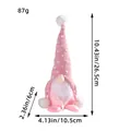 Handmade pink knitted Christmas gnome doll with white beard and plush ball details - Pink