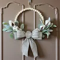 Detail view of cotton and lamb's ear wreath with a large striped ribbon bow decoration - 35cm(14 inch)