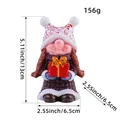 Detailed resin Christmas gnome figurine holding red gift box with dimension markings - Female Style (Z2-29)