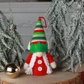 Cute Christmas gnome plush pendant featuring a red dress and tall red green striped hat - Elf Ears Female
