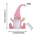 Pink wooden Christmas gnome ornament with dimensions showing 13cm height and 8cm width - Pink