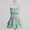 Vue détaillée d'une mini robe blanche bustier avec broderies vertes et violettes - Vert Imprimé