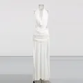 Detailed view of a white French style halter neck backless maxi dress with side slits - S / Dresses / White