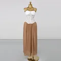 Detailed view of white lace corset top and brown pleated maxi skirt set on a gold mannequin - S / Top And Bottom / Khaki