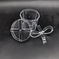 Detail view of transparent PS candy box showing lid and plastic bow decoration - Round Box (27g)